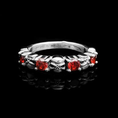 Red stones and skulls ring